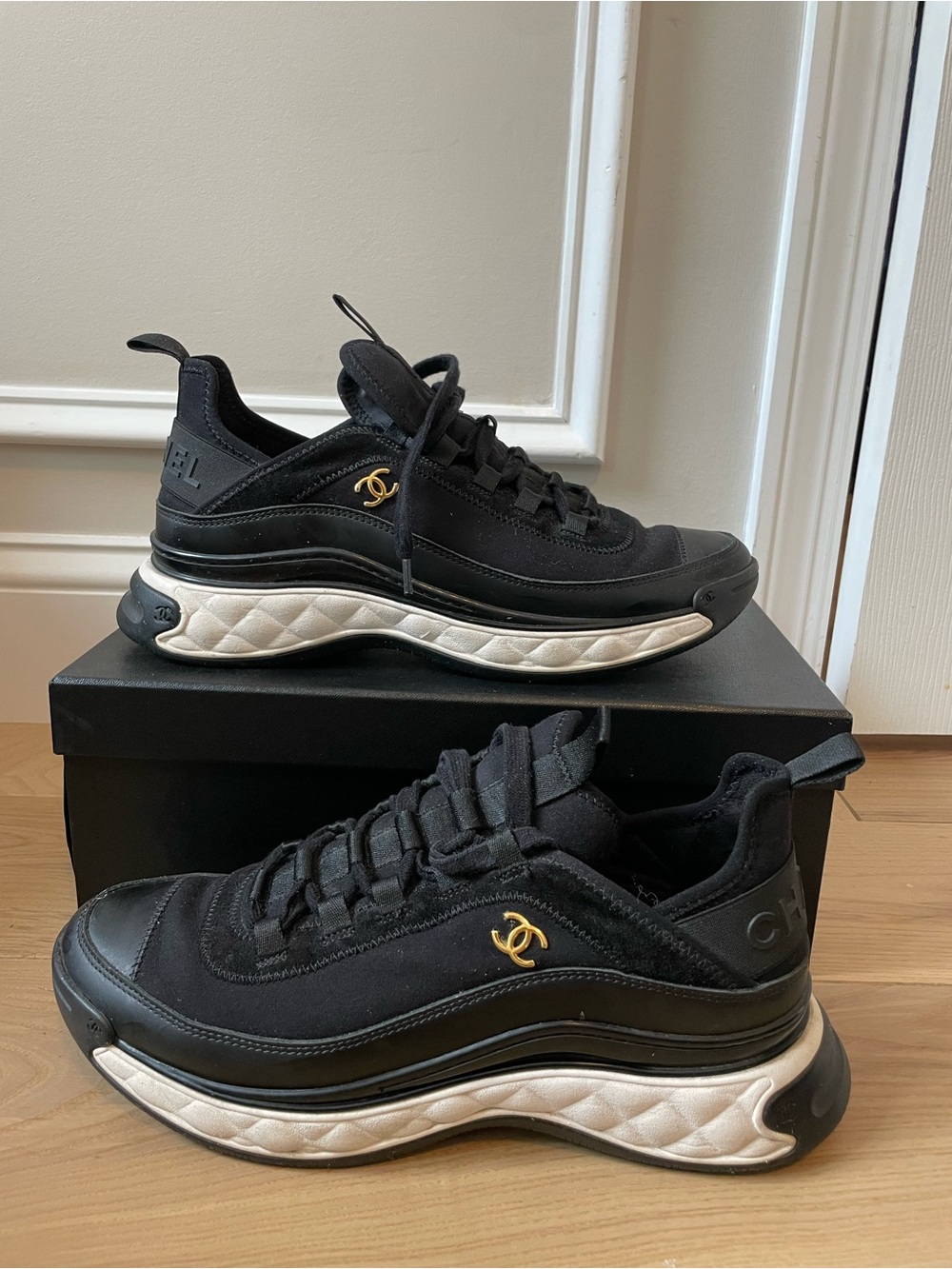 CHANEL Black and White Quilted-Trim Low-Top Sneakers
